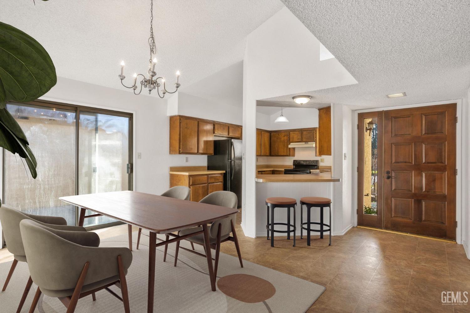 Undisclosed Address Bakersfield, CA 93309 - Photo 5 of 33 a view of a dining room with furniture and wooden floor