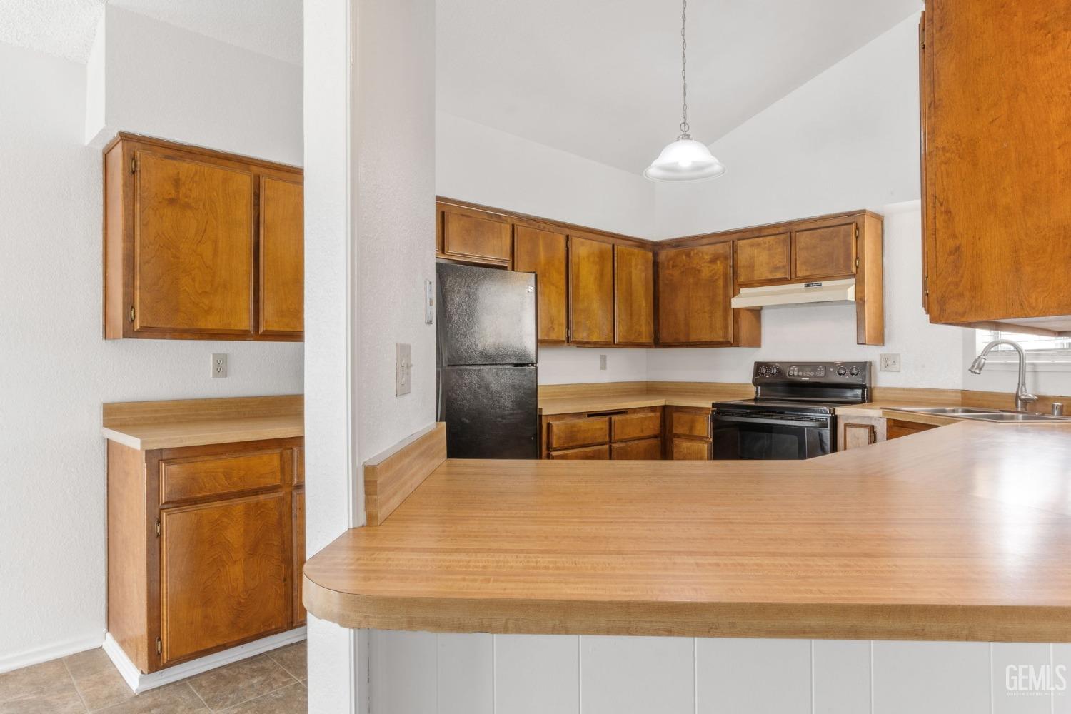 Undisclosed Address Bakersfield, CA 93309 - Photo 8 of 33 a kitchen with stainless steel appliances granite countertop a sink refrigerator and cabinets