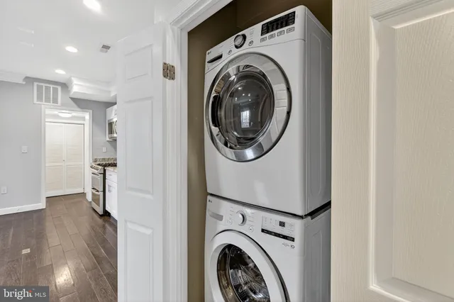 a view of a hallway with washer and dryer