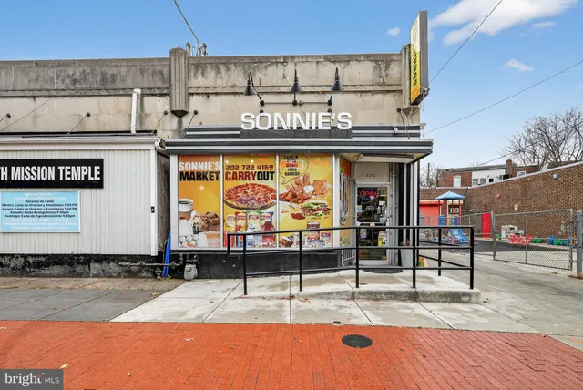 a view of a street with benches