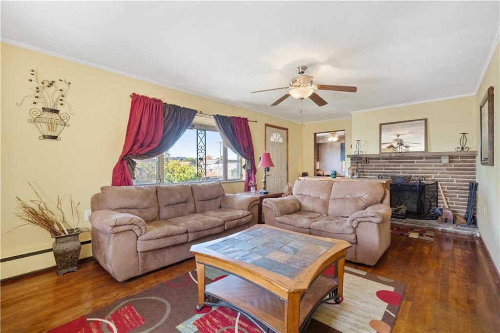 605 Duss Avenue Rochester, PA 15074 - Photo 4 of 25 a living room with furniture and a fireplace