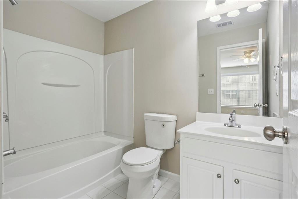 642 Bernay Way Atlanta, GA 30350 - Photo 18 of 20 a bathroom with a sink toilet and shower