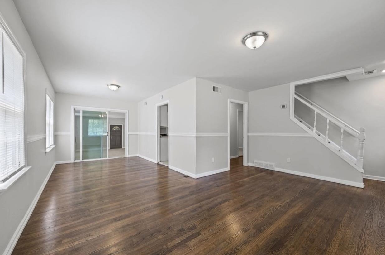 3843 Blue Jay Road Memphis, TN 38116 - Photo 6 of 23 a view of empty room with wooden floor and window