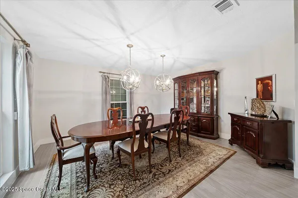 a view of a dining room with furniture