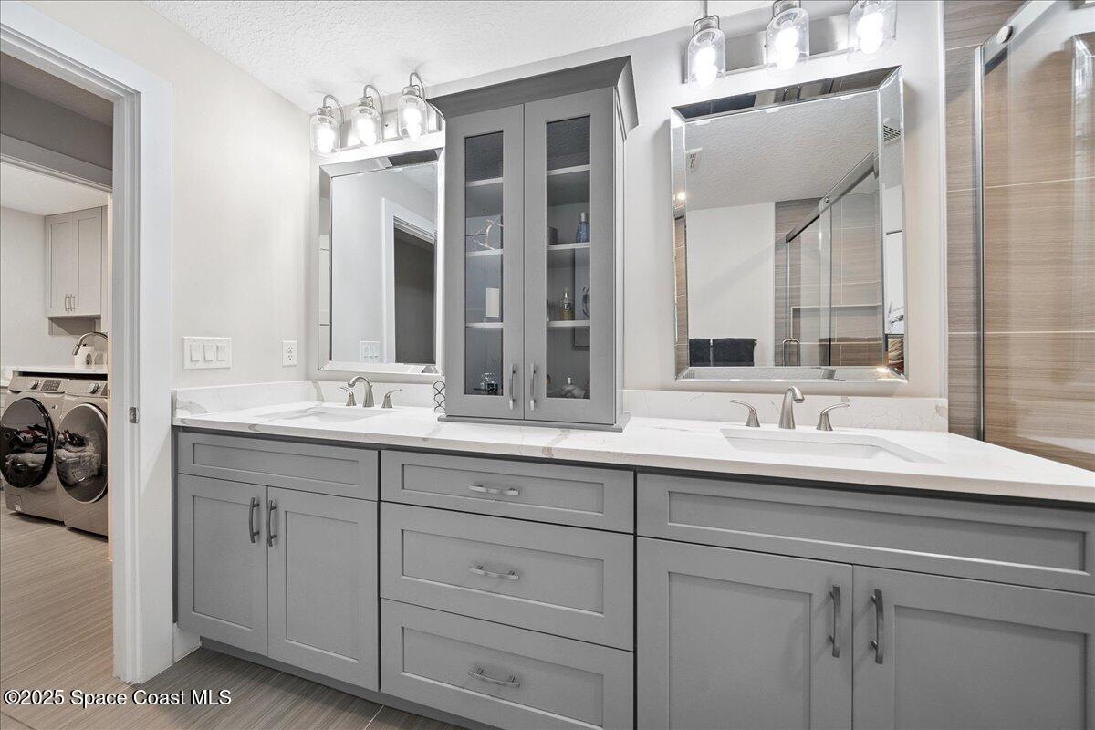 5685 Lake Washington Road Melbourne, FL 32934 - Photo 20 of 62 a bathroom with a sink and a mirror