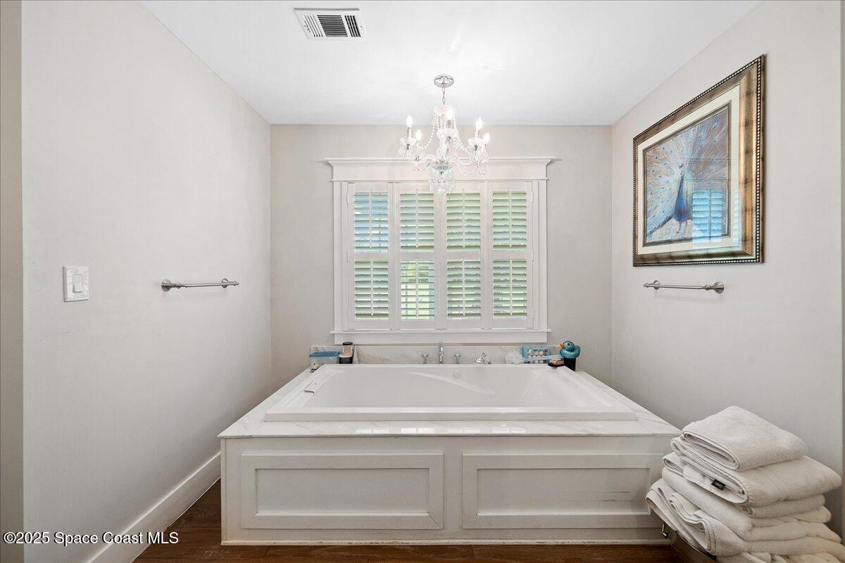 5685 Lake Washington Road Melbourne, FL 32934 - Photo 26 of 62 a bathroom with a sink and a window