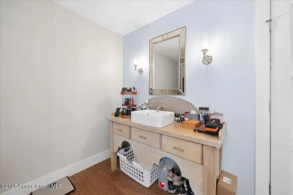a bathroom with a window and a shower