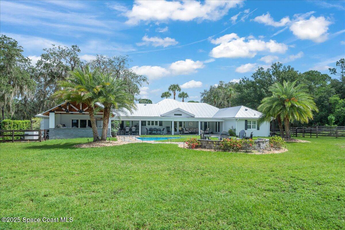5685 Lake Washington Road Melbourne, FL 32934 - Photo 39 of 62 a front view of a house with garden
