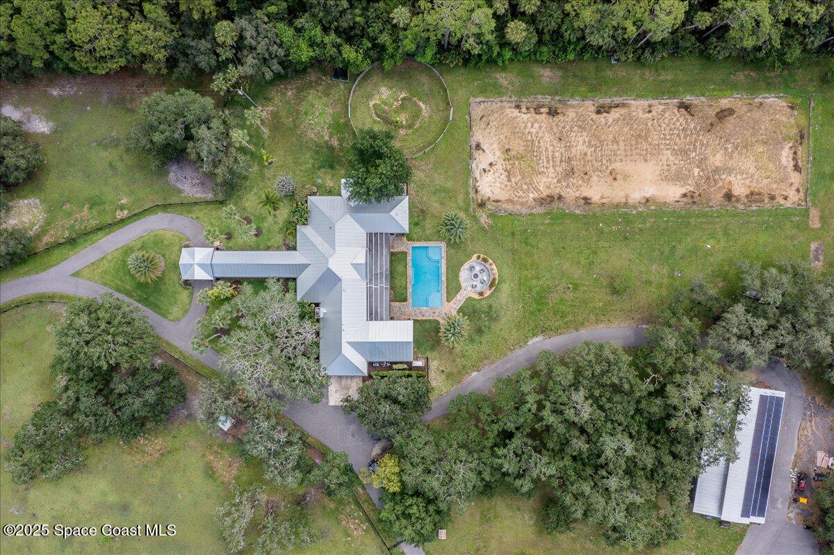 5685 Lake Washington Road Melbourne, FL 32934 - Photo 43 of 62 an aerial view of a house with a yard and lake view