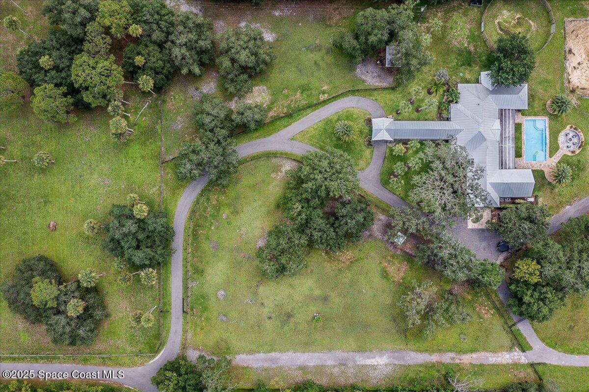 5685 Lake Washington Road Melbourne, FL 32934 - Photo 45 of 62 an aerial view of a house with a yard