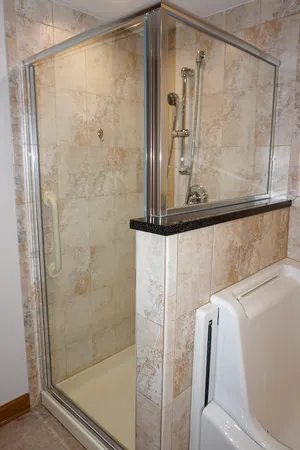 a bathroom with a sink vanity and a mirror