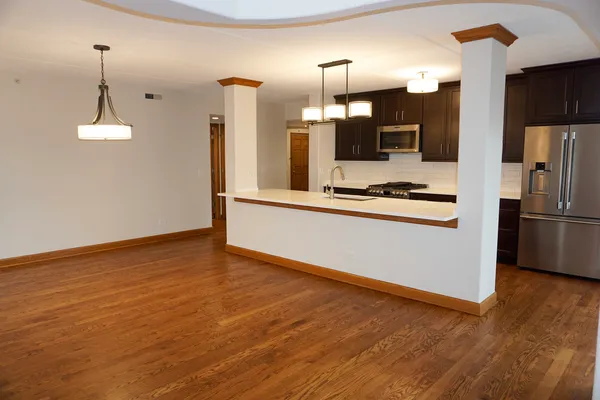 a kitchen with a sink and cabinets