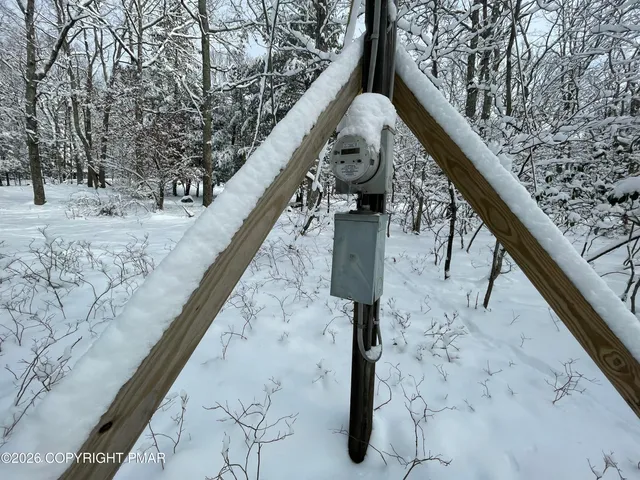a view of wooden fence and two of the front of the building