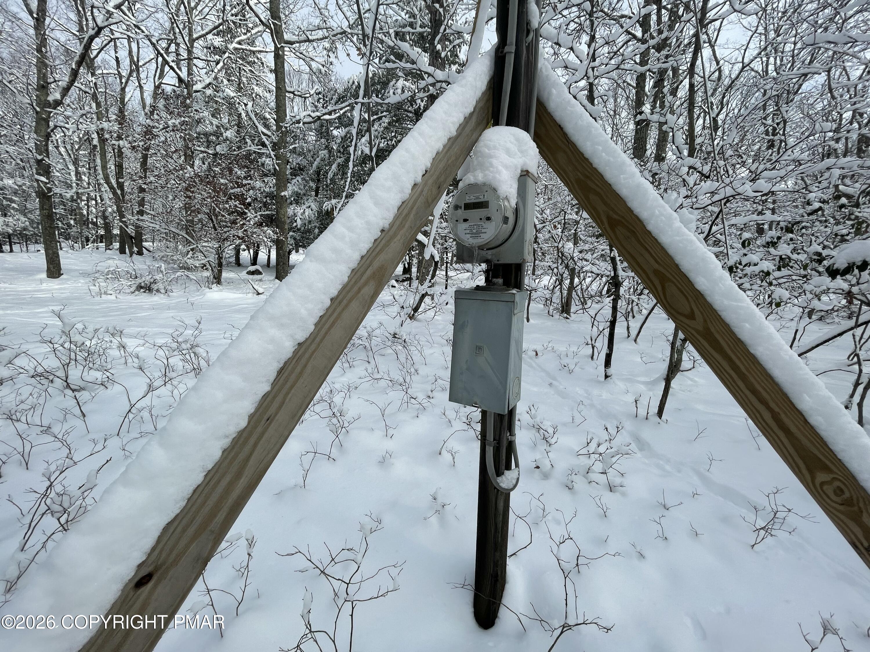 134 Maple Drive Cresco, PA 18326 - Photo 5 of 11 a view of wooden fence and two of the front of the building