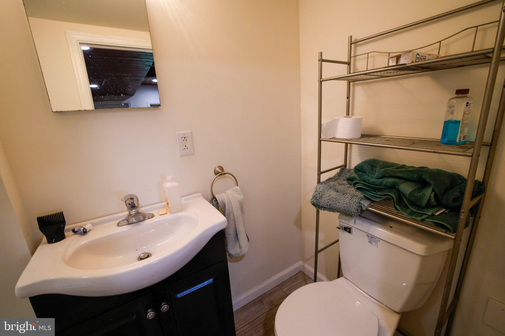 25 Keller Road Cochranville, PA 19330 - Photo 12 of 58 a bathroom with a sink a toilet and a mirror