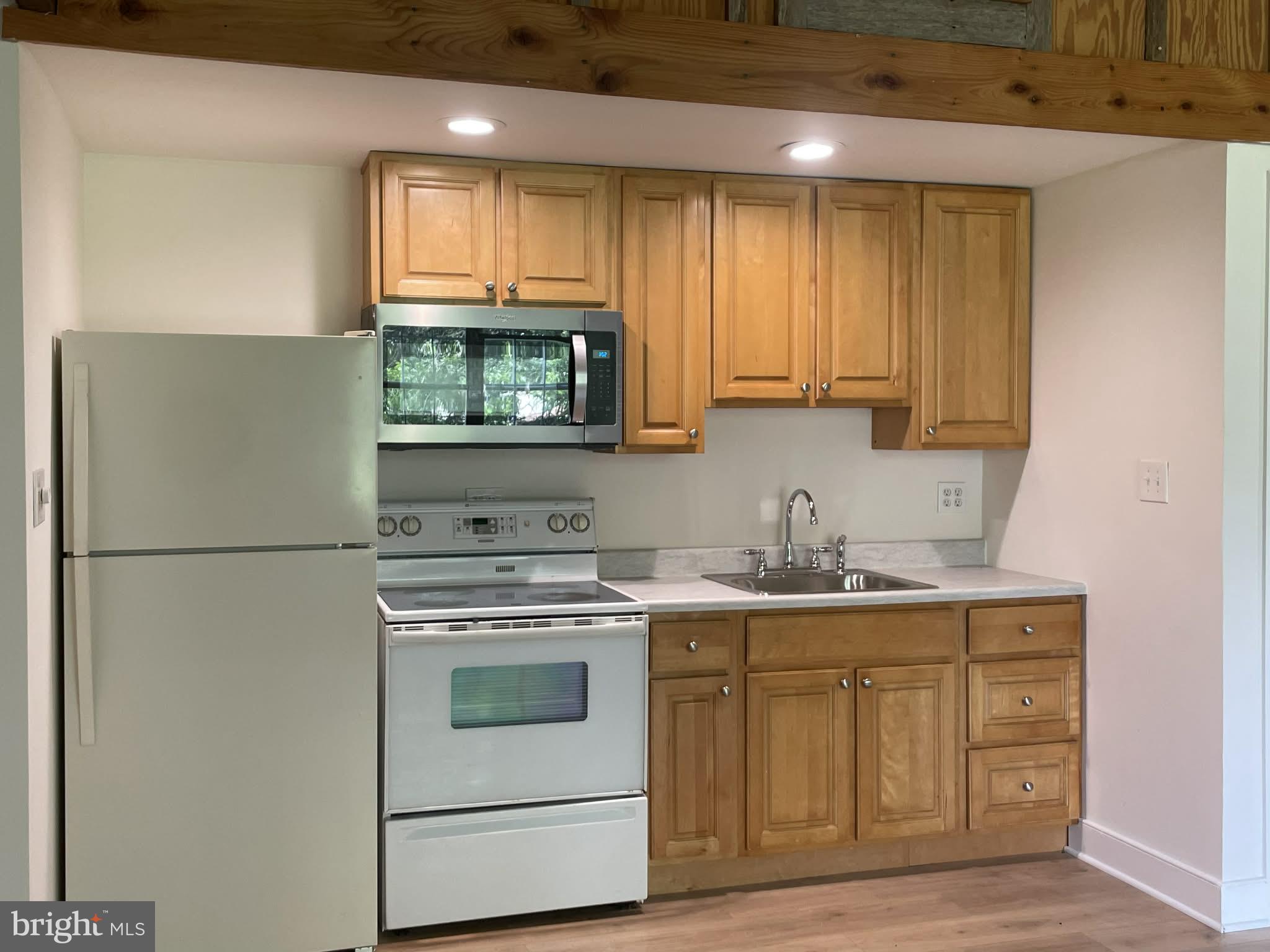 25 Keller Road Cochranville, PA 19330 - Photo 12 of 15 a kitchen with a stove microwave and sink