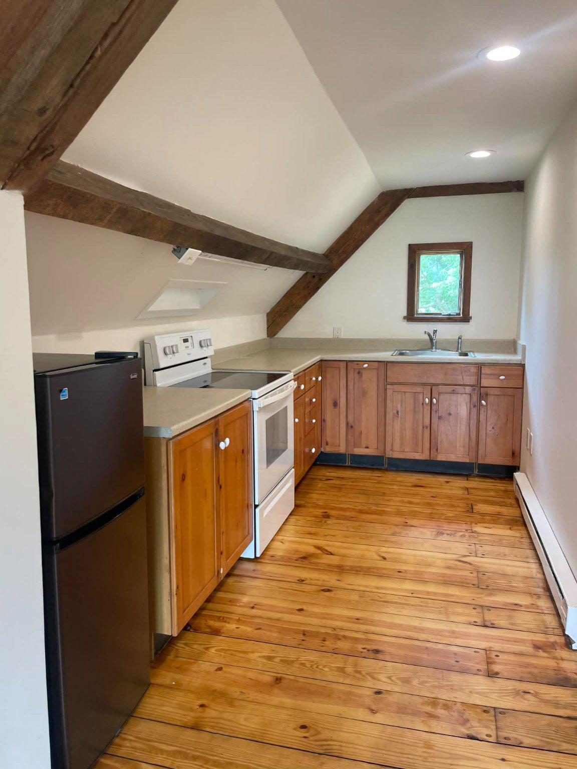 25 Keller Road Cochranville, PA 19330 - Photo 28 of 58 a view of a kitchen with stainless steel appliances wooden floor and cabinets