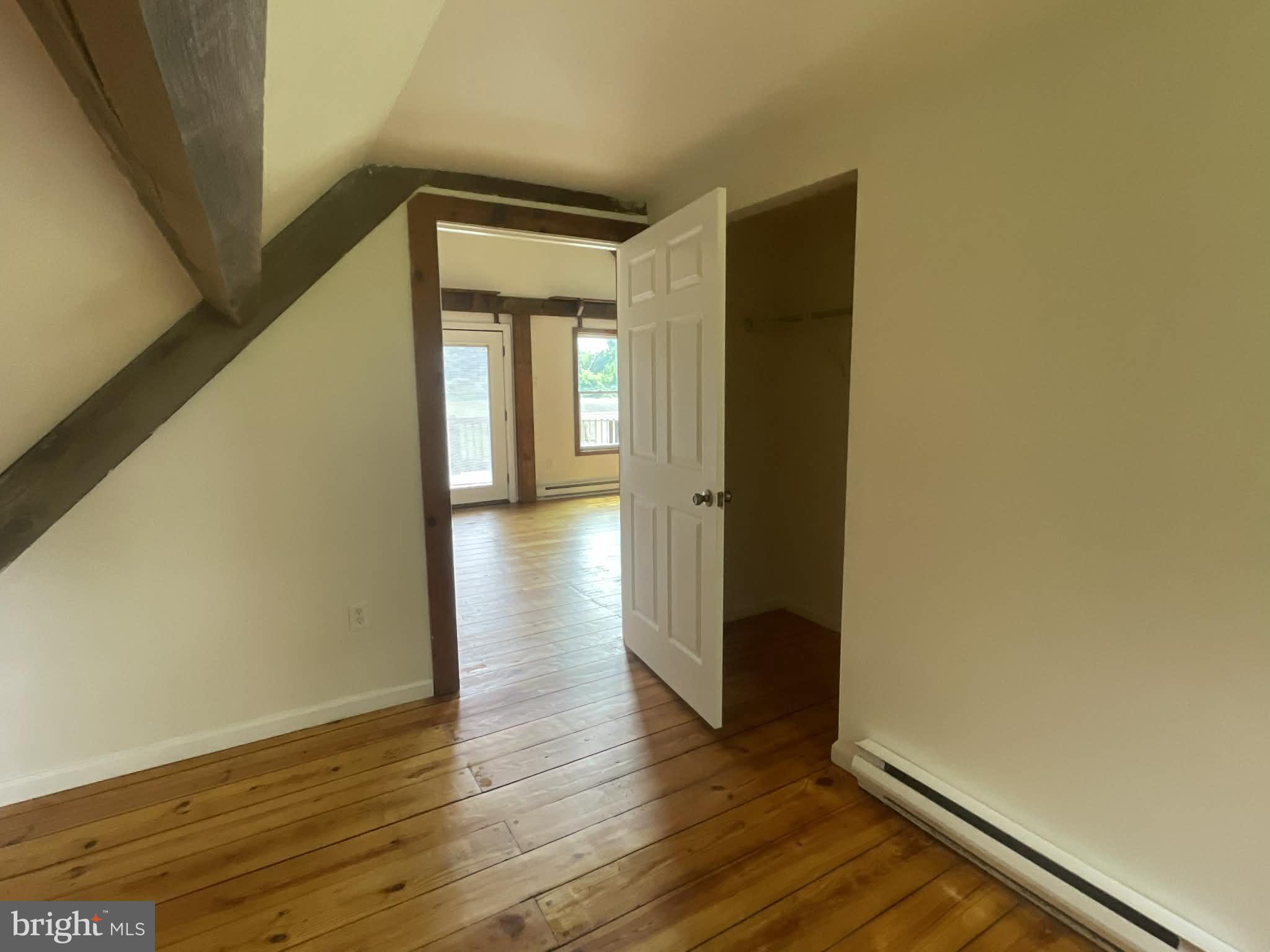 25 Keller Road Cochranville, PA 19330 - Photo 6 of 15 a view of an empty room with wooden floor and a window