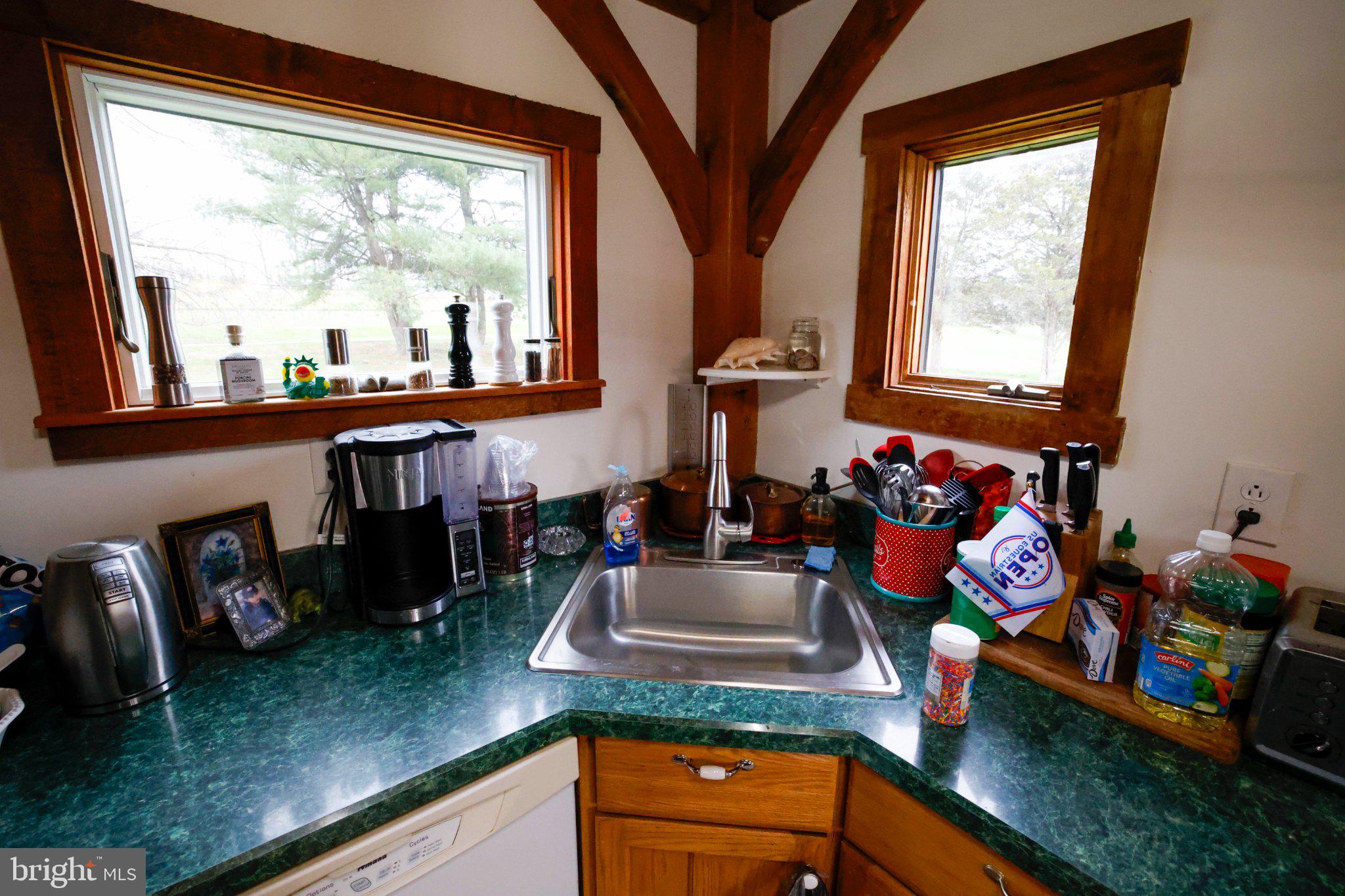 25 Keller Road Cochranville, PA 19330 - Photo 7 of 58 a kitchen area with granite countertop a stove a sink and a dining table
