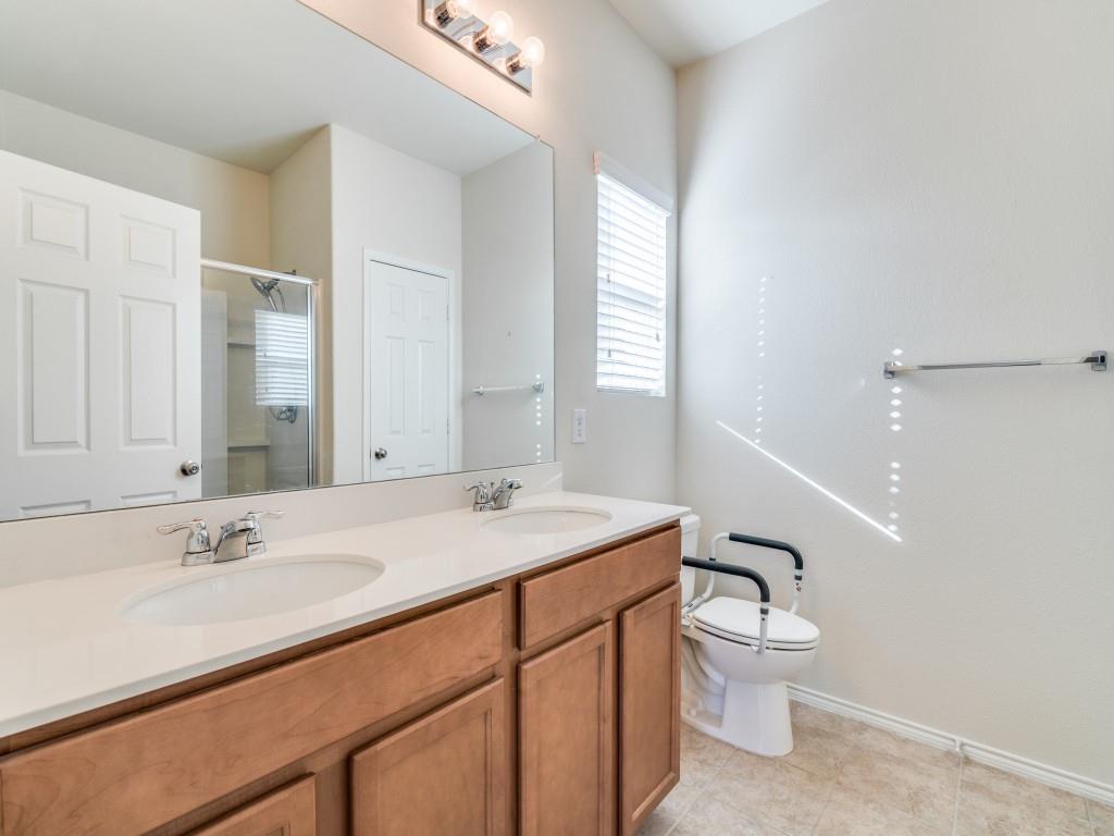 2232 Heaton Street Forney, TX 75126 - Photo 20 of 34 a bathroom with a sink toilet and vanity
