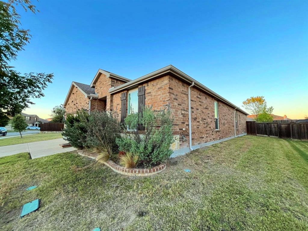 2232 Heaton Street Forney, TX 75126 - Photo 2 of 34 a front view of a house with garden