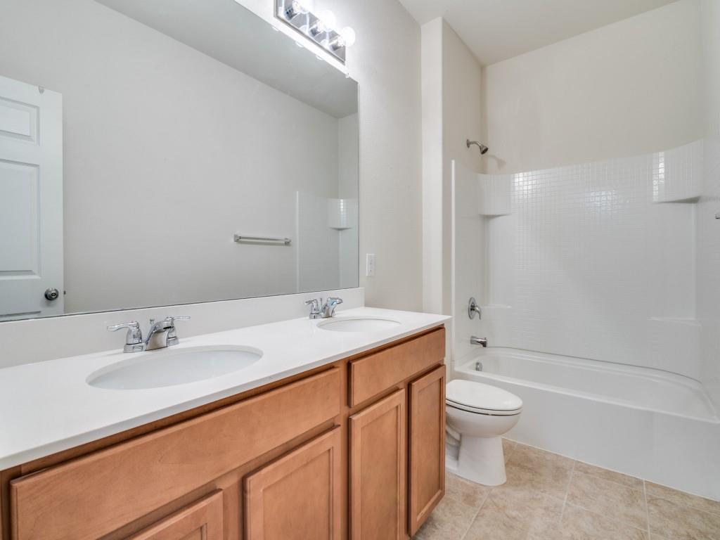 2232 Heaton Street Forney, TX 75126 - Photo 25 of 34 a bathroom with a sink toilet and shower
