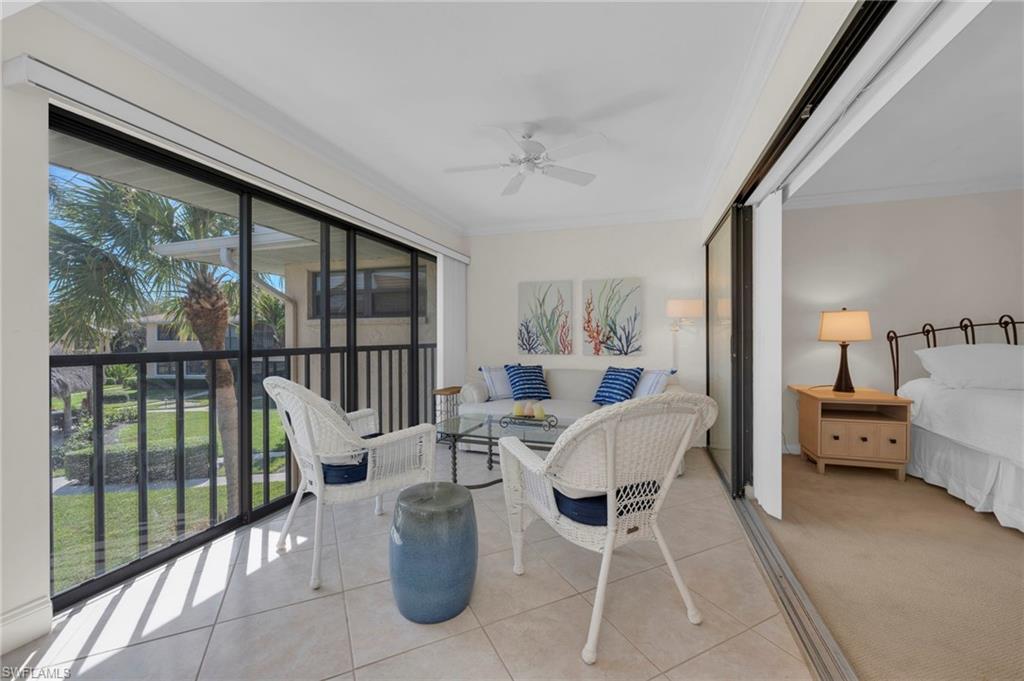 1100 9th Street South, Unit D201 Naples, FL 34102 - Photo 12 of 25 a view of a dining room with furniture window and outside view