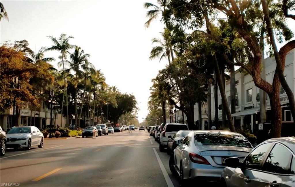 1100 9th Street South, Unit D201 Naples, FL 34102 - Photo 21 of 25 a view of street with parked cars