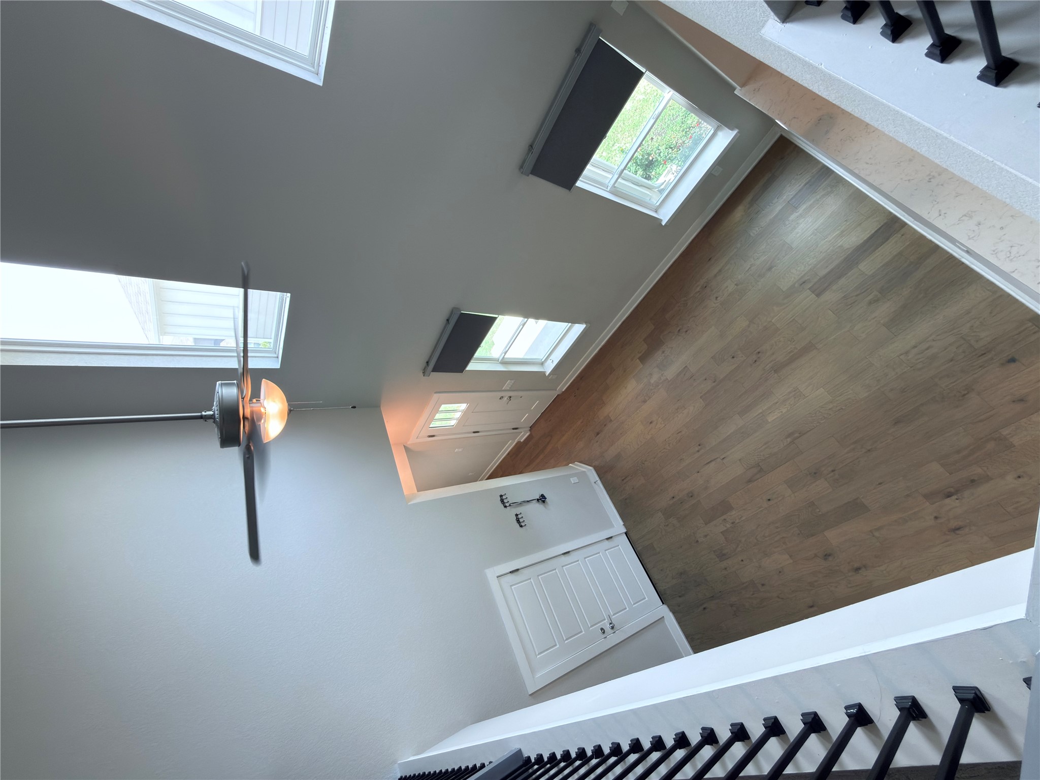 11216 Gadsen Lane Austin, TX 78754 - Photo 31 of 36 Tall ceilings and abundant natural light illuminate the welcoming entry with rich wood flooring.