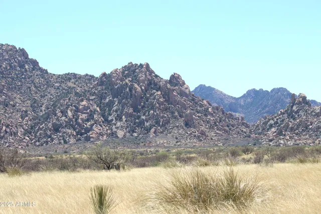 a view of lake with mountain in the background