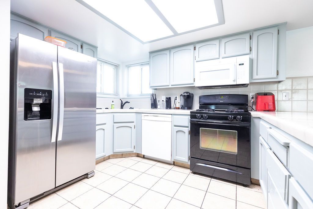 324 East Upjohn Avenue Ridgecrest, CA 93555 - Photo 11 of 35 a kitchen with stainless steel appliances granite countertop a refrigerator sink and cabinets