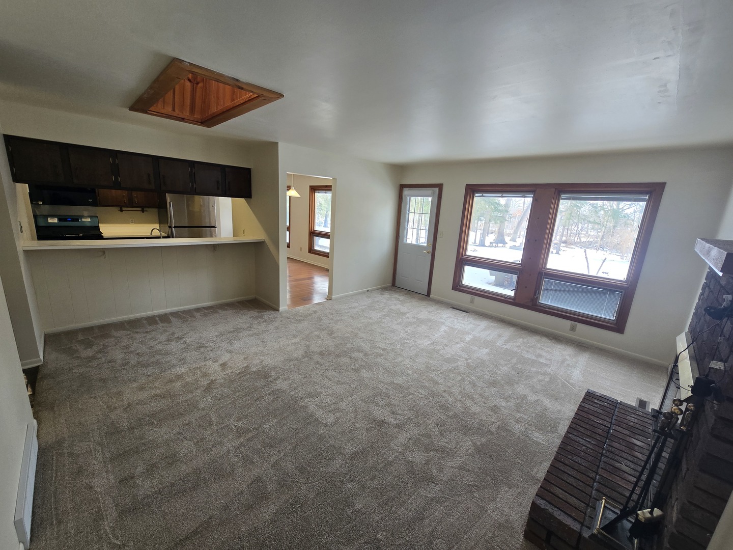 905 Hickory Road Woodstock, IL 60098 - Photo 12 of 32 a view of an empty room with window and stairs