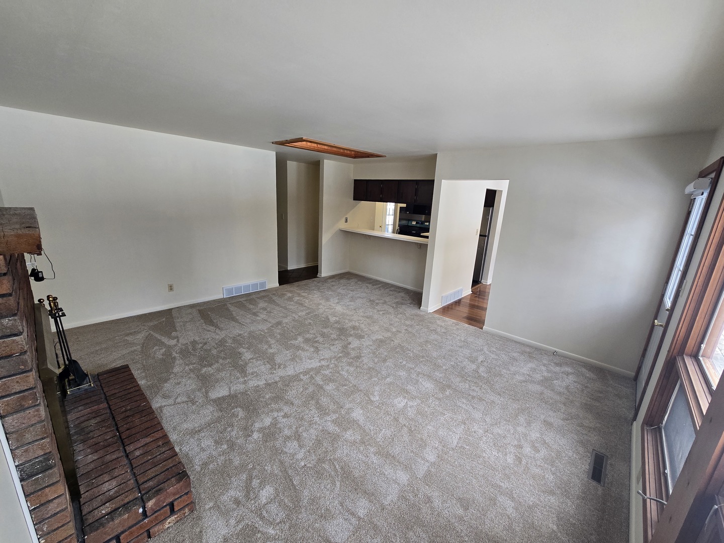 905 Hickory Road Woodstock, IL 60098 - Photo 13 of 32 a view of an empty room with kitchen