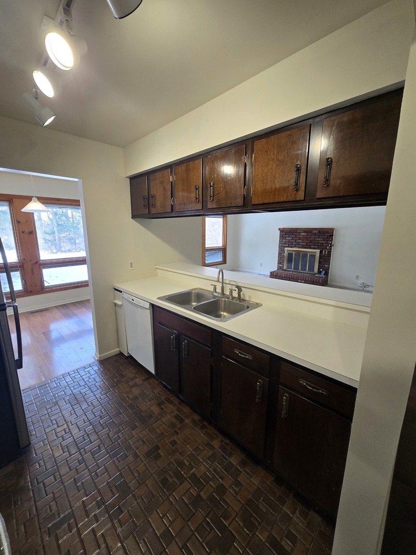 905 Hickory Road Woodstock, IL 60098 - Photo 16 of 32 a bathroom with a sink and a large mirror