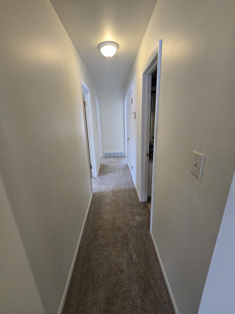 905 Hickory Road Woodstock, IL 60098 - Photo 21 of 32 a view of a hallway