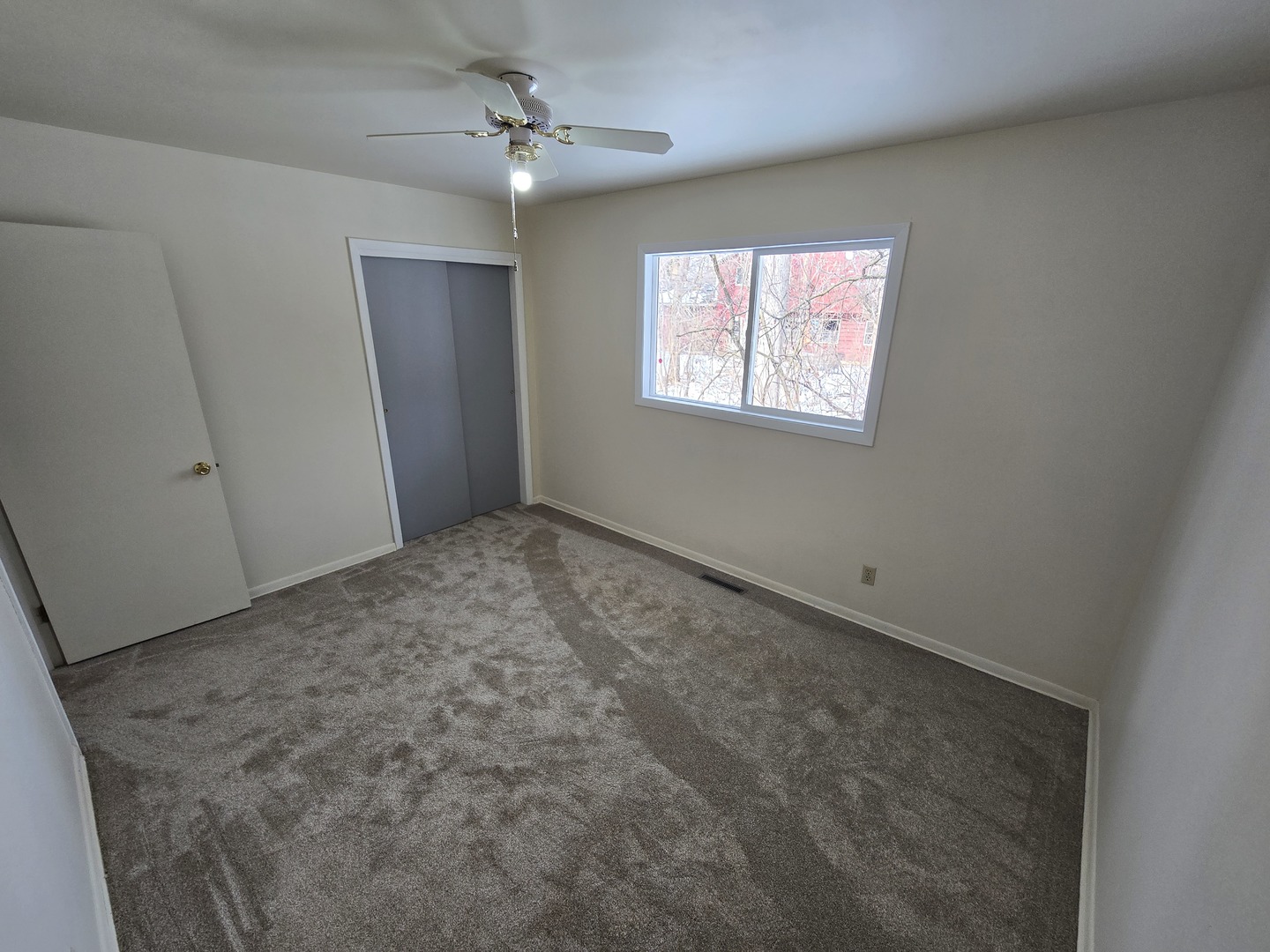 905 Hickory Road Woodstock, IL 60098 - Photo 27 of 32 a view of an empty room with a window