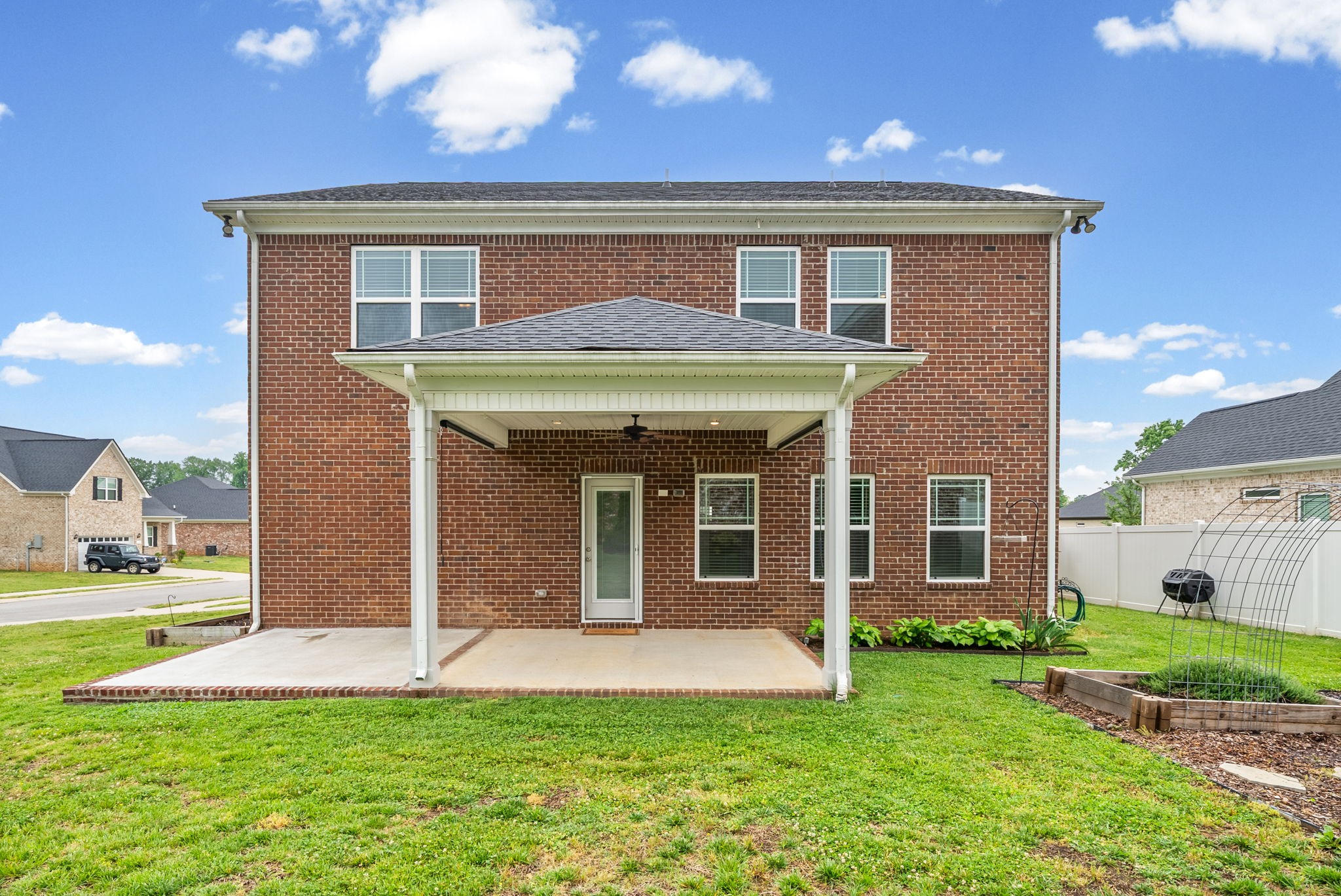 719 Reflections Lane Pleasant View, TN 37146 - Photo 36 of 46 a view of a house with a yard and plants