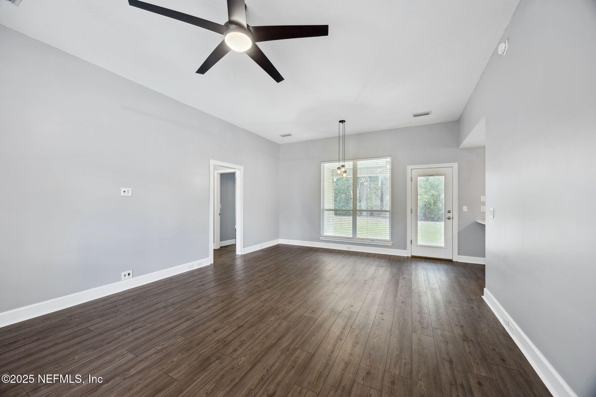 13193 Caldwell Road Jacksonville, FL 32226 - Photo 11 of 50 wooden floor in an empty room with a window