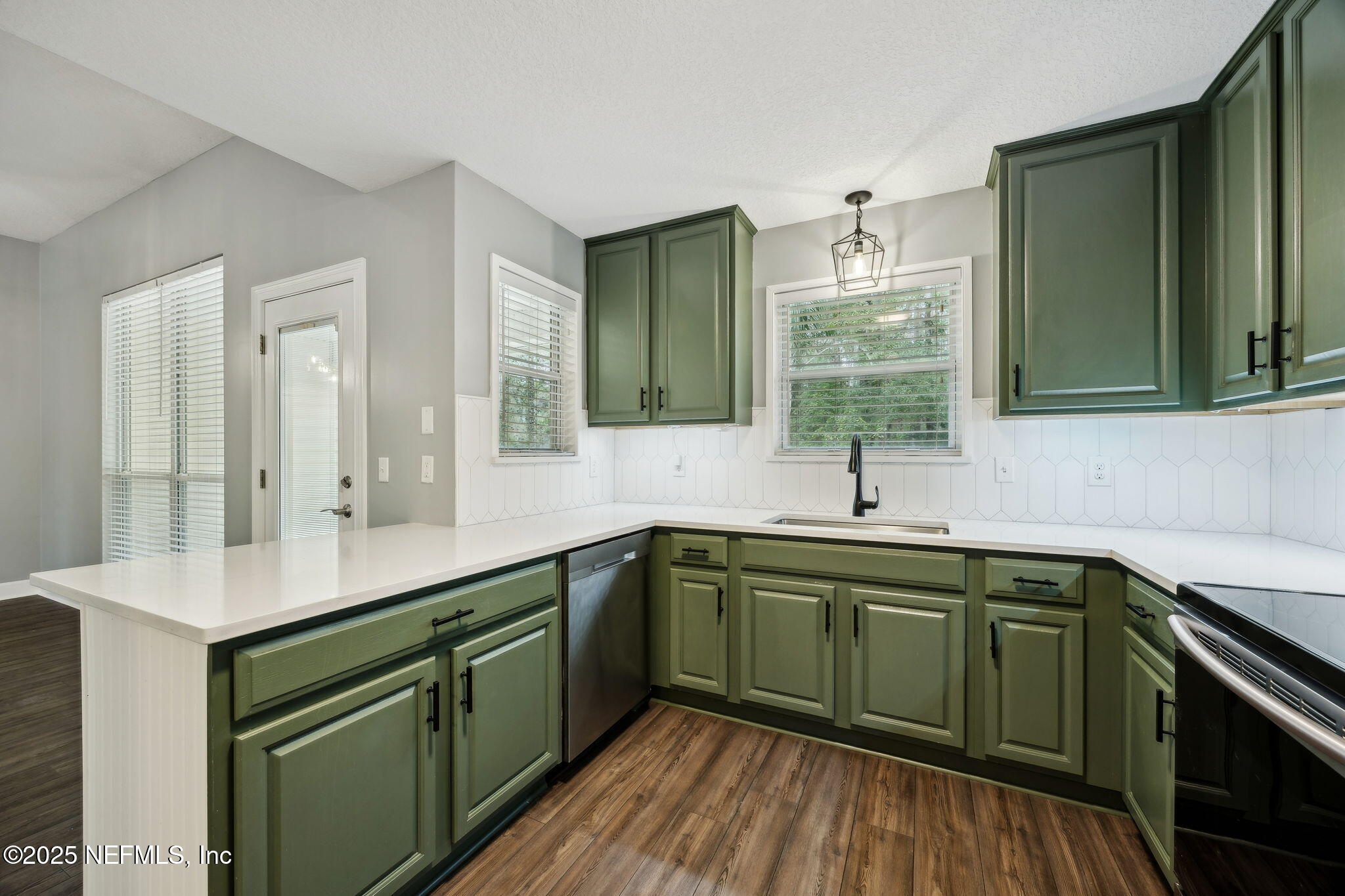 13193 Caldwell Road Jacksonville, FL 32226 - Photo 15 of 50 a kitchen with sink and cabinets