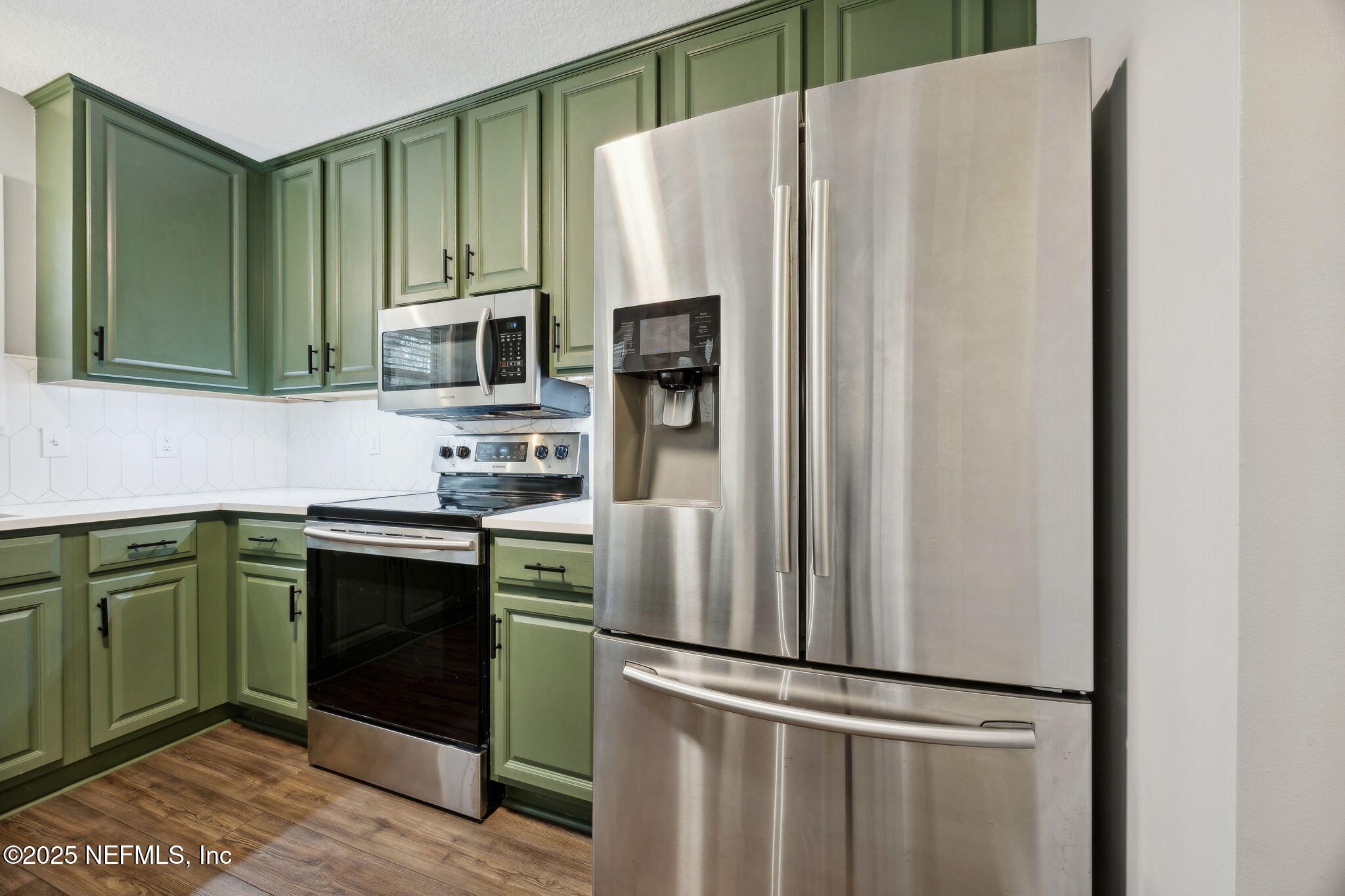 13193 Caldwell Road Jacksonville, FL 32226 - Photo 16 of 50 a kitchen with stainless steel appliances granite countertop a refrigerator and a sink