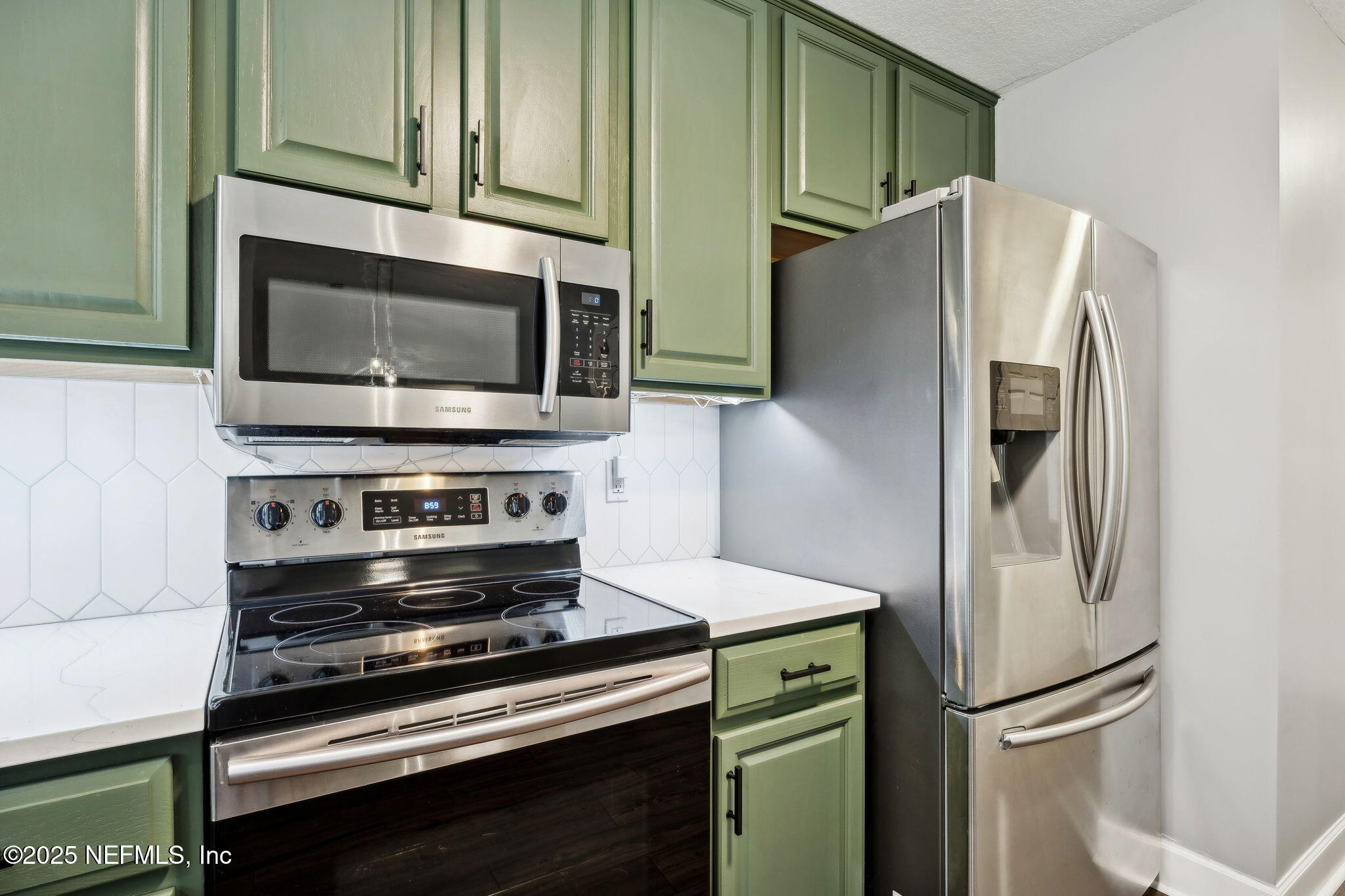 13193 Caldwell Road Jacksonville, FL 32226 - Photo 17 of 50 a kitchen with stainless steel appliances and refrigerator