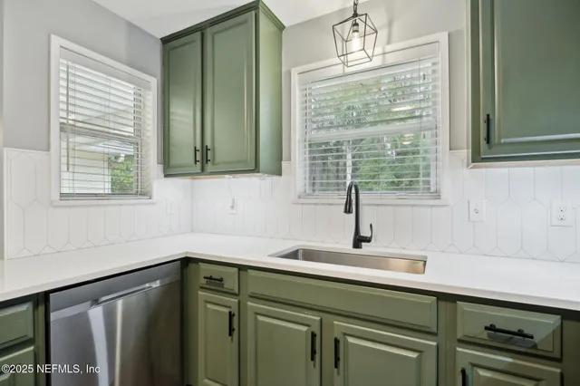 a kitchen with a sink and a window