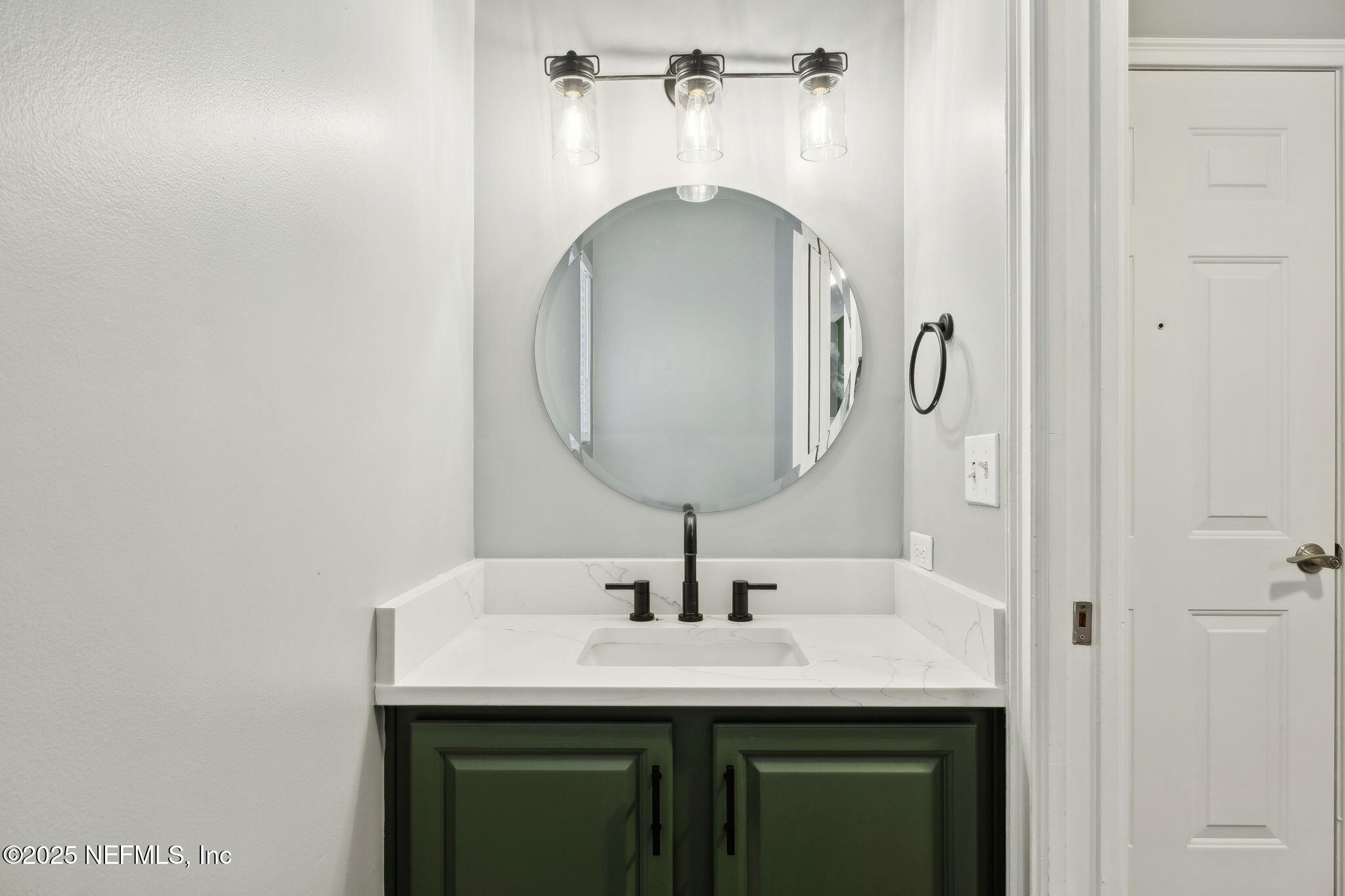 13193 Caldwell Road Jacksonville, FL 32226 - Photo 31 of 50 a bathroom with a sink and a mirror