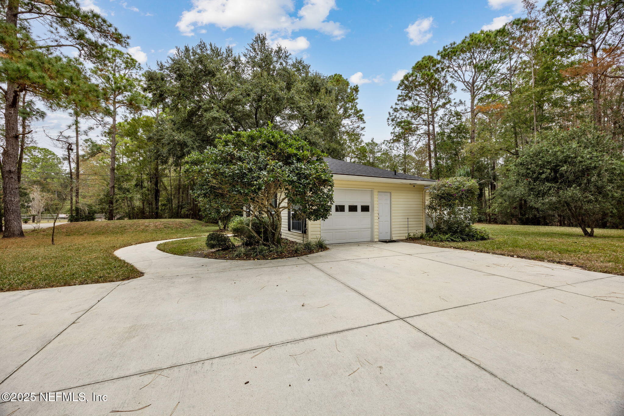 13193 Caldwell Road Jacksonville, FL 32226 - Photo 34 of 50 a view of a white house with a outdoor space