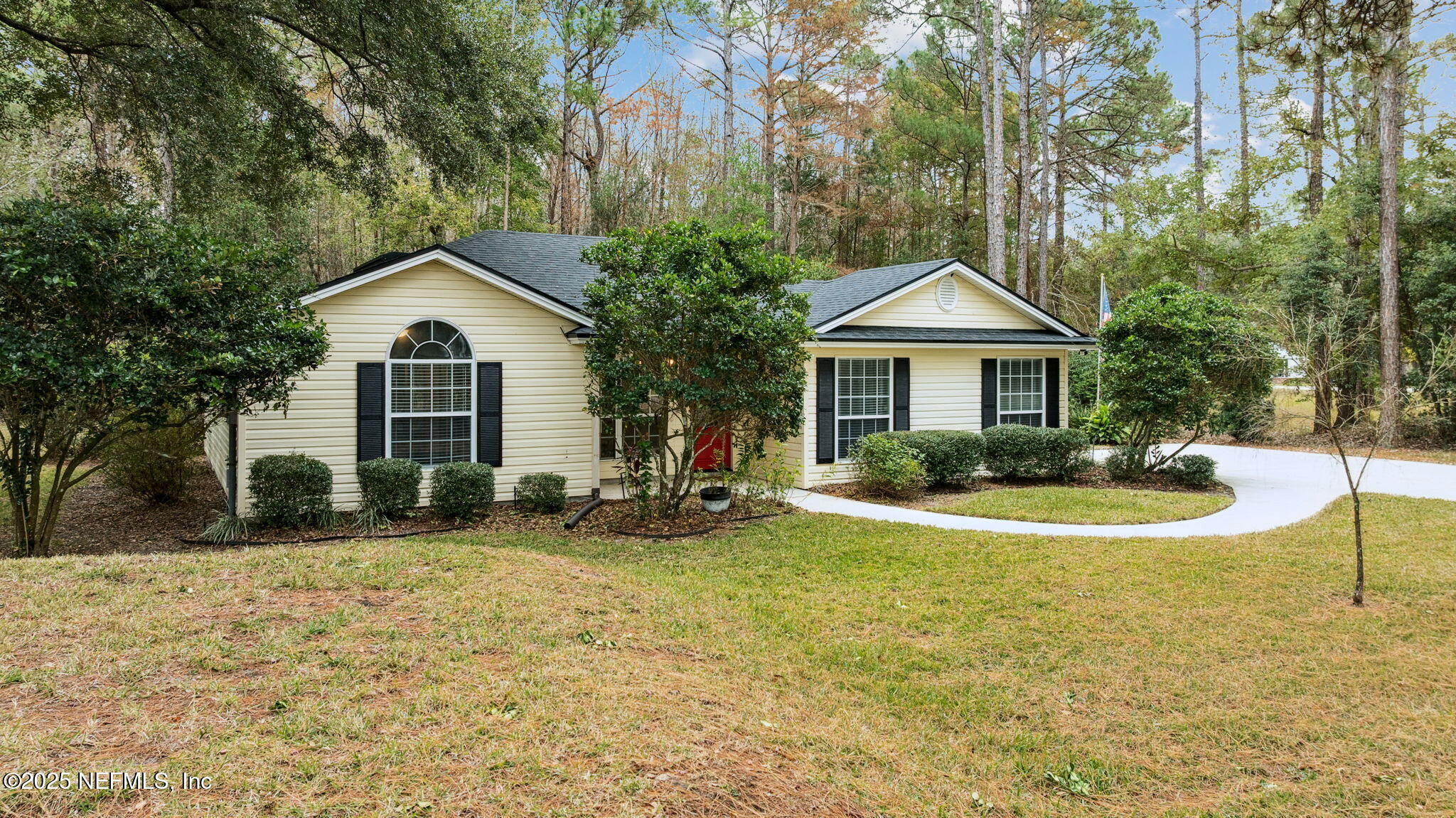 13193 Caldwell Road Jacksonville, FL 32226 - Photo 43 of 50 a front view of a house with a yard and trees
