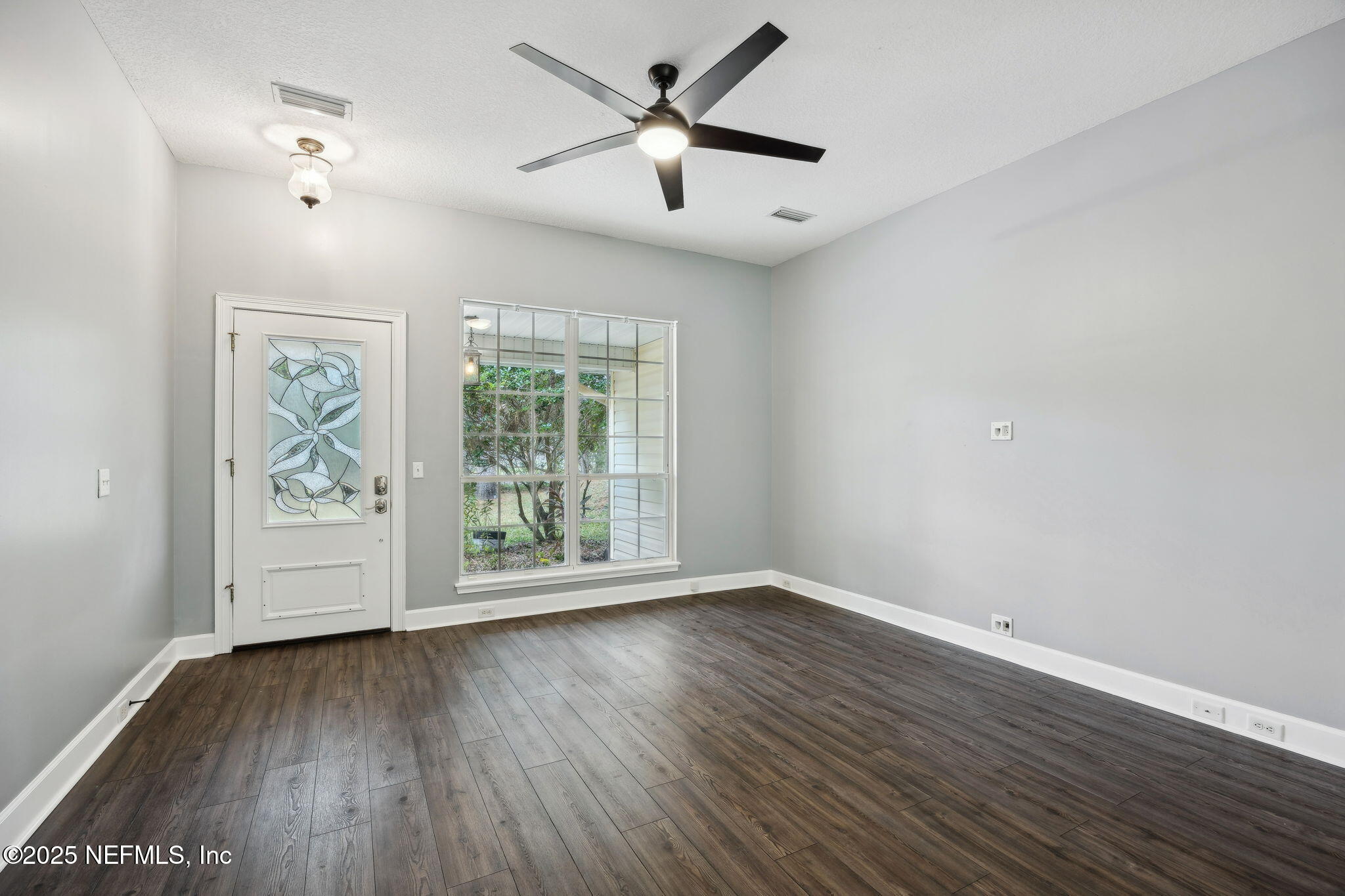 13193 Caldwell Road Jacksonville, FL 32226 - Photo 8 of 50 wooden floor in an empty room with a window