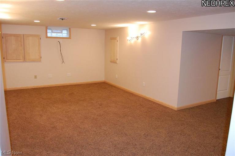 7283 Huntington Road Hudson, OH 44236 - Photo 20 of 24 Lower level boasts 2 recreational areas with newer carpeting, lighting and drywall.