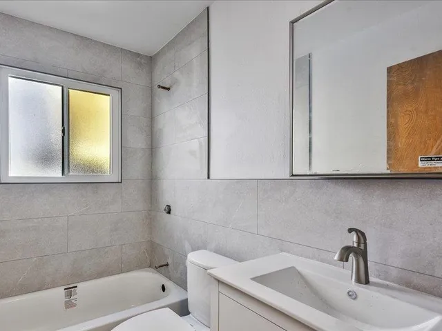 a bathroom with a sink and a bathtub