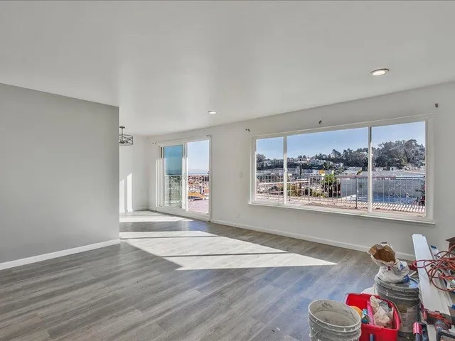 a view of livingroom with furniture wooden floor and windows