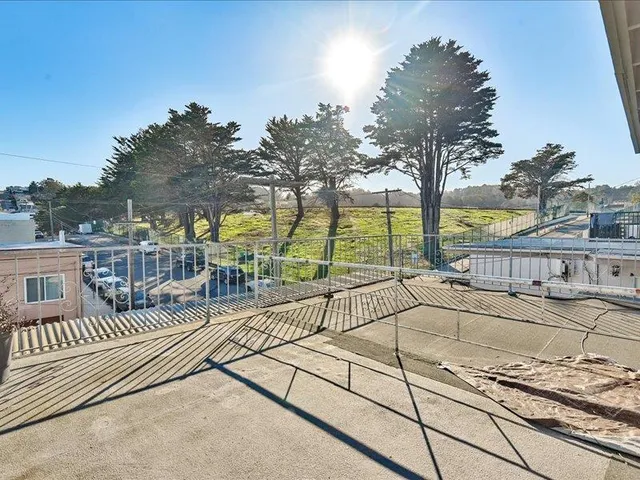a view of a terrace with trees